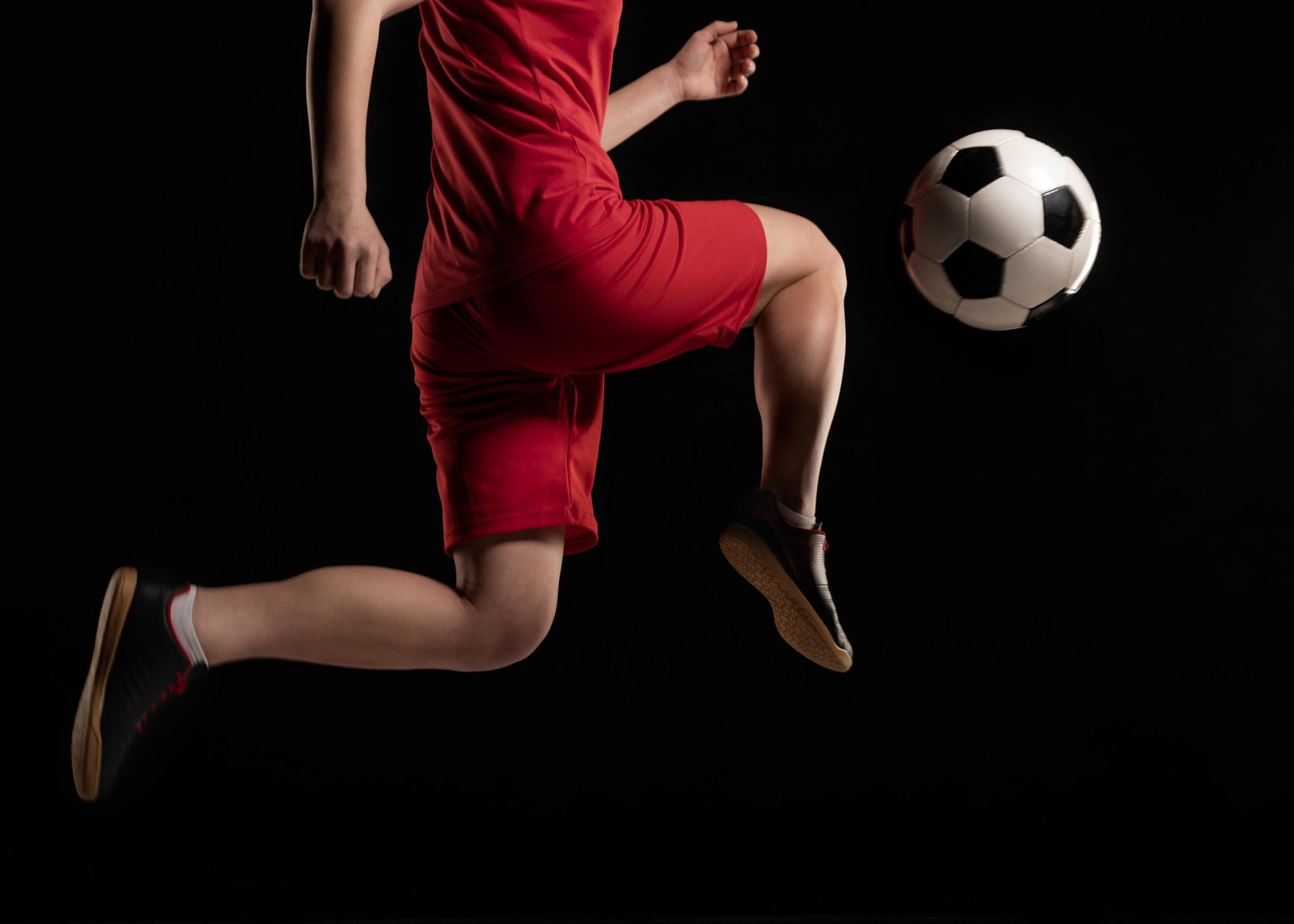 close-up-woman-kicking-baell-with-knee